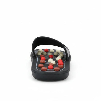 EVEREASE black acupressure slippers with adjustable multi-colored massage knobs and velcro strap on white background