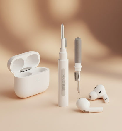 EVEREASE HAGiBiS white earbuds cleaning pen tool with metal tip and brush next to wireless charging case and earbuds