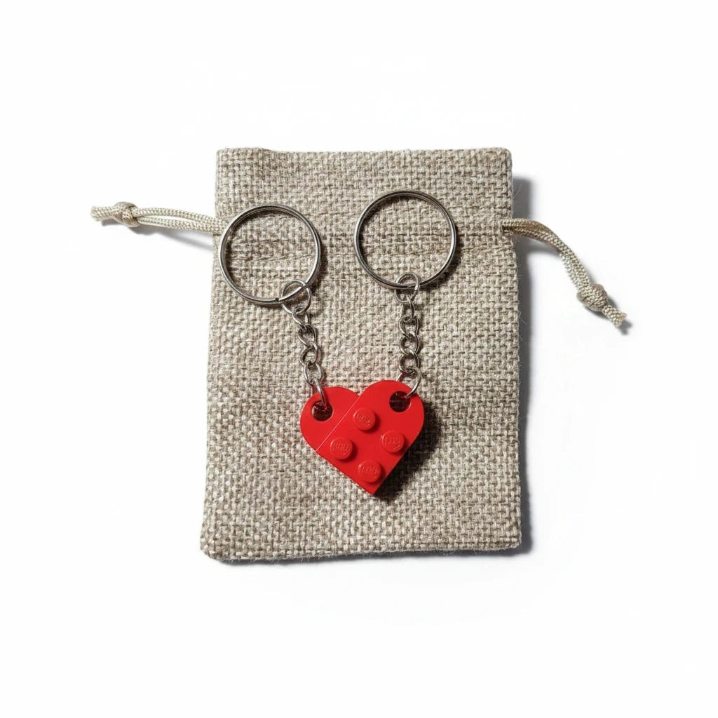 EVEREASE matching red heart shaped brick keychains for couples displayed on a small rustic burlap drawstring bag