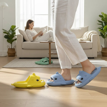 EVEREASE shark-shaped open toe slide sandals in blue and yellow worn by a person in a bright living room