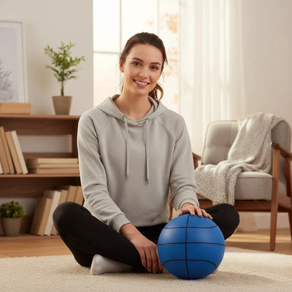 EVEREASE silent training basketball in blue, held by a smiling woman sitting on a living room floor.