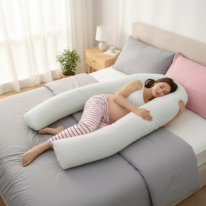 EVEREASE U-shaped full body maternity support pillow in light grey cradling a pregnant woman sleeping on a bed